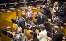 DA MPs congratulate their Parliamentary leader Mmusi Maimane on his 'broken man, broken country' speech during the Sona 2015 debate. Picture: Thomas Holder/EWN.