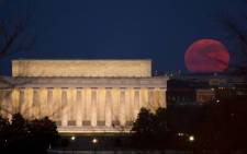 FILE: The full moon is seen as it rises near the Lincoln Memorial, Saturday, 19 March 2011, in Washington. Picture: Nasa/Bill Ingalls
