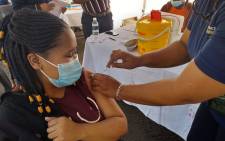 Nomvelo Radebe (22) from Soweto just received her jab at Bara Taxi Rank on 20 August 2021. All public vaccination sites in Gauteng accept walk-ins whether people are registered on the EVDS or not. Picture: @GautengHealth/Twitter.