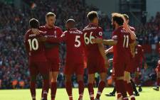 Liverpool players celebrate after beating Wolves in their Premier League match on Sunday. Picture: @LFC/Twitter.