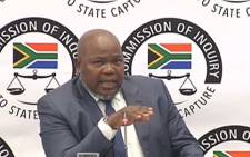 A screenshot shows Mxolisi Nxasana at the state capture inquiry on 2 September 2019.