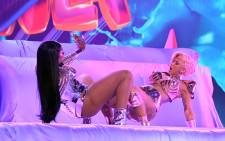 In this handout photo courtesy of The Recording Academy, Megan Thee Stallion and Cardi B perform during the 63rd Annual Grammy Awards ceremony broadcast live from the Staples Center in Los Angeles on 14 March 2021. Picture: Kevin Winter/The Recording Academy/AFP
