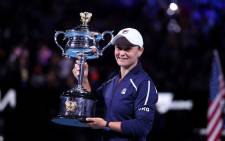 Australia's Ashleigh Barty holds her trophy following her victory in the women's singles final match against Danielle Collins of the US on day thirteen of the Australian Open tennis tournament in Melbourne on 29 January 2022. Picture: Aaron Francis/AFP