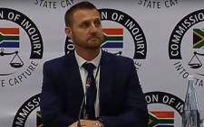 A  screengrab of former SIU lead investigator Clint Oellermann giving evidence at the Zondo Commission on 1 April 2019.
