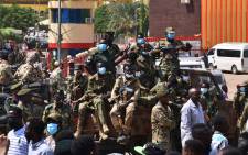 Sudanese security forces keep watch as they protect a military hospital and government offices during protests against a military coup overthrowing the transition to civilian rule on 25 October 2021. Picture: AFP
