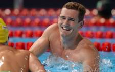 SPAIN, Barcelona: South Africa's Cameron Van Der Burgh celebrates after winning the final of the men's 50-metre breaststroke swimming event in the FINA World Championships at Palau Sant Jordi in Barcelona on July 31, 2013. Picture: AFP 