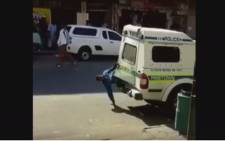 A screengrab showing how one of two men escaped from a parked police van in Pinetown.