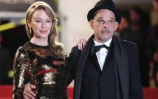 Australian actress Kylie Minogue and French Actor Denis Lavant arrive for the screening of "Holy Motors".
