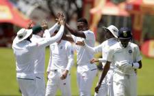 Lungi Ngidi (centre) celebrates a wicket with his Proteas teammates. Picture: AFP