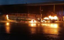 A Golden Arrow bus and another vehicle were set alight at the Nyanga terminus on 28 May 2021. Picture: Supplied