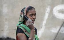 An Indian woman speaks on a mobile phone in Suraj village in Mehsana district, some 100 km from Ahmedabad, in February 2016. Picture: AFP.
