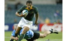South Africa's Ashwin Willemse (C) runs past a tackle from Uruguay's Emiliano Ibarra during their Rugby World Cup Pool C match at the Subiaco Oval in Perth, Western Australia on 11 October 2003. Picture: Reuters