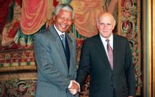 FILE: Nelson Mandela, African National Congress (ANC) President (left) and South Africa's last apartheid President Frederik de Klerk (right), shake hands on 10 December 1993 in Oslo after being awarded the Nobel Peace Prizes. Picture: AFP
