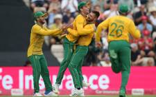 South Africa's Tristan Stubbs (C/L) celebrates with teammates after taking a catch for the dismissal of England's Moeen Ali during the third T20 international cricket match between England and South Africa at The Ageas Bowl in Southampton, southern England on 31 July 2022. Picture: Steve Bardens/AFP