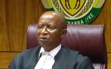 A screengrab of Judge Phineas Mojapelo delivering judgment in the Equality Court related to the apartheid flag on 21 August 2019. 