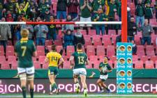 South Africas' Herschel Jantjies (R) scores his first try on debut with the Springboks during the 2019 Rugby Championship match, South Africa v Australia, at the Emirates Airline Park in Johannesburg, on 20 July 2019. Picture: AFP.
