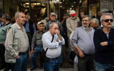 FILE: Pensioners take part in a demonstration outside the Ministry of Finance against planned pension reforms, in central Athens, 25 April, 2018. Picture: AFP