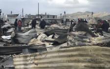 FILE: Masiphumelele residents survey the damage a day after a fire swept through the settlement on 29 July 2019. Picture: Monique Mortlock/EWN