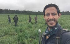 South African wildlife vet Joe Alves and his team of trackers in a natural forest clearing shortly after collaring an elephant cow. Picture: Joe Alves