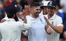 England’s James Anderson (C) celebrates bowling out Australia’s Peter Nevill on the first day of the third Ashes cricket test match between England and Australia at Edgbaston in Birmingham, central England, on 29 July, 2015. Picture: AFP.