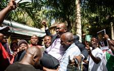 This file photo taken on 15 May 15 2015 shows Willy Nyamitwe (C) being carried by supporters in the Kamenge quarter of Bujumbura. Picture: AFP.