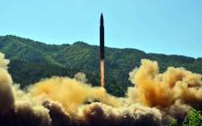 This picture taken on 4 July 2017 and released by North Korea's official Korean Central News Agency on 5 July 2017 shows the successful test-fire of the intercontinental ballistic missile Hwasong-14 at an undisclosed location. Picture: AFP.