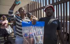 Angry consumers seen outside the Enterprise factory outlet in Germiston, where they donated their money back. Picture: Thomas Holder/EWN