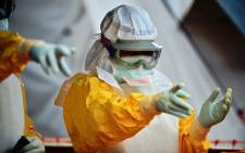 FILE: An MSF medical worker, wearing protective clothing at an MSF Ebola treatment facility in Kailahun, on 15 August 2014. Picture: AFP