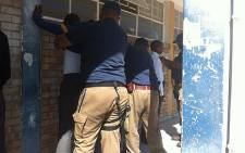 Police and metro police search pupils from Bulumko Secondary School on 6 September 2012. Picture: Chanel September/EWN