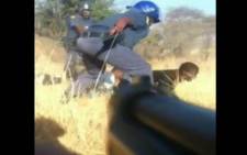A screengrab of cellphone footage taken from the Marikana massacre. 