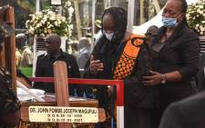 Maria Nyerere (2R), the widow of the first Tanzanian President Mwalimu Julius Nyerere, mourns during the national funeral of the fifth Tanzanian president John Magufuli at Uhuru Stadium in Dar es Salaam, on March 20, 2021. Picture: AFP.