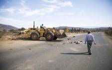 A bulldozer clears protest debris from the road in Masiya, Vuwani in Limpopo. Picture: Thomas Holder/EWN