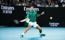 Novak Djokovic hits a return during his Australian Open match against Milos Raonic on 28 January 2020 in Melbourne, Australia. Picture: @AustralianOpen/Twitter