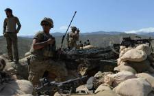 FILE: In this photograph taken on 11 April 2017, US soldiers take up positions during an ongoing an operation against Islamic State militants in the Achin district of Afghanistan's Nangarhar province. Picture: AFP.