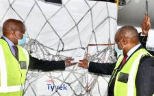 Deputy President David Mabuza and President Cyril Ramaphosa celebrate the arrival of the first million doses of the AstraZeneca COVID-19 vaccine at OR Tambo International Airport on 1 February 2021. Picture: GCIS.