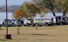 Police drivers on the shore of Hartbeespoort Dam were conducting a search for the toddler who fell out of capsized boat on 11 May 2015. Picture: Louise McAuliffe/EWN.