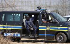 Members of the police's tactical response team on standby at Lonmin's Marikana Mine. Picture: Taurai Maduna/EWN.