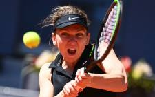 Romania's Simona Halep returns the ball to Belgium's Elise Mertens during their 2021 WTA Tour Madrid Open tennis tournament singles match at the Caja Magica in Madrid on 4 May 2021. Picture: Gabriel Bouys/AFP