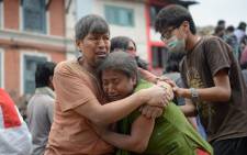People being rescued from rubble in Kathmandu, Nepal after a devestating earthquake. Picture: AFP.