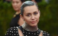 FILE: Miley Cyrus arrives at the 2015 Metropolitan Museum of Art’s Costume Institute Gala benefit on 4 May 2015 in New York. Picture: AFP.