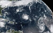 FILE: This NOAA/RAMMB satellite image taken at 13:30 UTC on 9 September 2018, shows (L-R) Tropical Storm Florence, Tropical Storm Isaac and Tropical Storm Helene in the Atlantic Ocean. Picture: AFP.