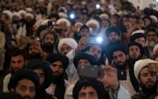 Taliban members listen to Afghanistan's Prime Minister Mohammad Hassan Akhund during a gathering at the former presidential palace in Kabul on August 13, 2022. Picture:
Wakil KOHSAR / AFP.