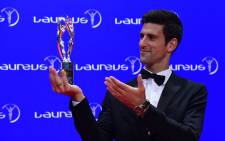Tennis player Novak Djokovic of Serbia poses with his Laureus World Sportsman of the Year trophy at the Laureus World Sports 2016 Awards Ceremony in Berlin on 18 April, 2016. Picture: AFP.