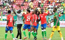 Gambia's midfielder Musa Barrow (2R) celebrates with teammates at the end of the Group F Africa Cup of Nations (CAN) 2021 football match between Gambia and Mali at Limbe Omnisport Stadium in Limbe on January 16, 2022.  Picture: Issouf SANOGO / AFP
