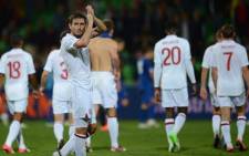 Frank Lampard of England applauds at the supporters at the end of the match against Moldova during their World Cup 2014 qualifier football match in Chisinau city September 7, 2012. Picture: AFP.