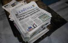 Police in Nicaragua raided the premises of independent newspaper La Prensa on 13 August 2021, which had branded the government a "dictatorship" after being forced to suspend its print edition. AFP