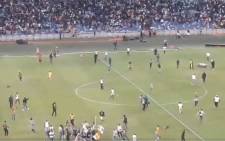 Kaizer Chiefs invaded the pitch and severely beat up a security guard on Saturday night following the team’s loss to the Free State Stars in the Nedbank Cup. Picture: Screengrab