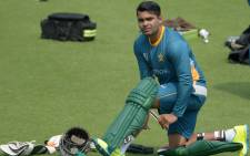FILE: Pakistan's Umar Akmal pads up he takes part in a training session ahead of the World T20 cricket tournament match at The Eden Gardens Cricket Stadium in Kolkata on 13 March 2016. Picture: AFP.
