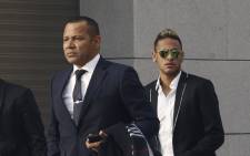 FC Bracelonas Brazilian striker Neymar and his father Neymar Sr at their arrival to the National Court to give evidence on his transfer in Madrid, Spain, on 2 February 2016. Picture: EPA/KIKO HUESCA.
