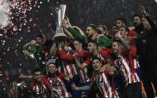 Atletico Madrid players celebrate their victory in the final over Olympique de Marseille on 16 May 2018. Picture: AFP